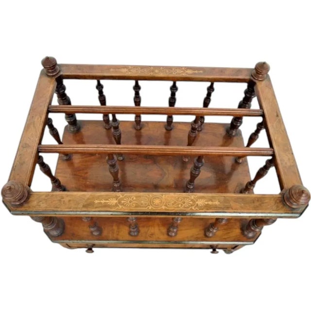 English walnut and satinwood inlay and ebonite’s Canterbury newspaper/book rack; early Victorian circa 1860; Molded top...