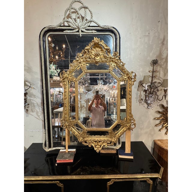 The 19th c. French Louis XV Giltwood Cushion Mirror is a luxurious and elegant addition to any home decor. This mirror...