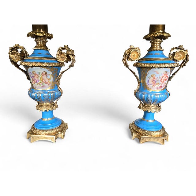 Pair of 19th Century French Sèvres Style Porcelain and Gilt Bronze Lamps Elegant pair of lamps crafted from 19th-century...