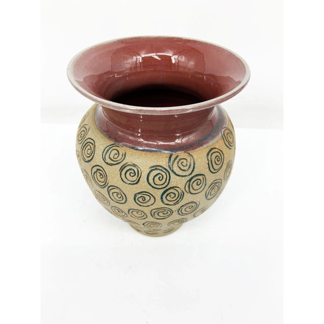 The Elliot Hutten Hog-Shed Pottery Swirl Design Signed and Stamped Vase is a stunning piece of handcrafted ceramic art...