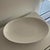 This elegant oval platter is a hallmark of Nikko's commitment to minimalist luxury. Crafted from fine bone china, the...