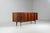 Stunning and rare sideboard by Erik Buch, produced by Oddense Møbler in Denmark in the 1960s. It is a refined example of...