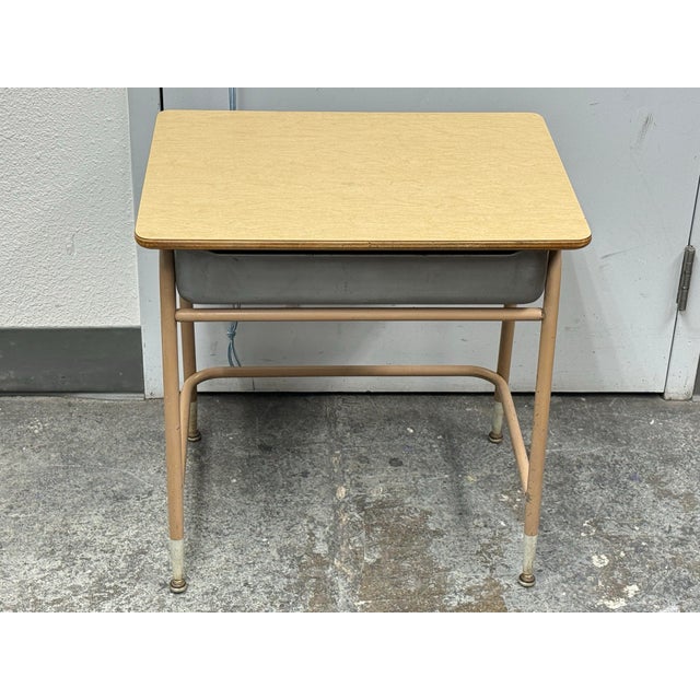 Design Plus Gallery presents a Mid 20th Century Lift-Top Student Desk. The desk features a pale plywood writing surface,...