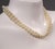 This costume jewelry necklace from the 1980s combines classic charm with a modern touch. The design captivates with its...