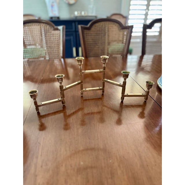 Midcentury piece! How cool for your party table?! Made in Taiwan, this is a fun brass candelabra. It can move, fold and...