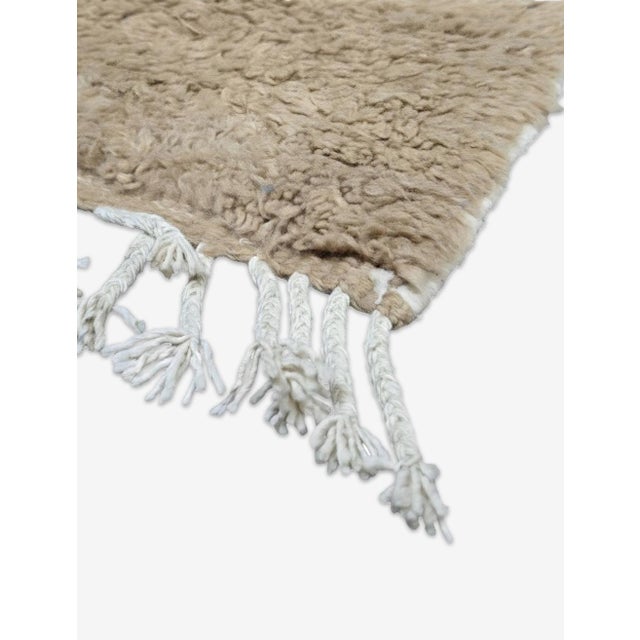 Boujad Rug | Handwoven Berber Wool Rug with Warm Taupe Linear Design This understated Boujad rug features a solid warm...