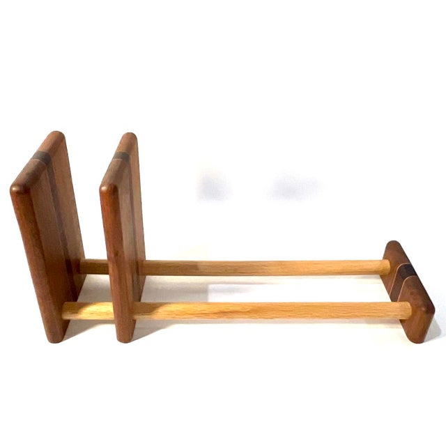 Talk about a blast from the past. This unique set of "sliding" adjustable bookends was crafted out of solid inlaid wood....