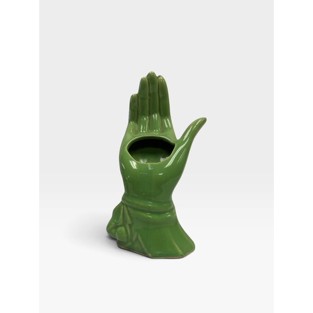 Add a striking, sculptural touch of mid-century curiosity to your space with this vintage Surrealist style hand vase....