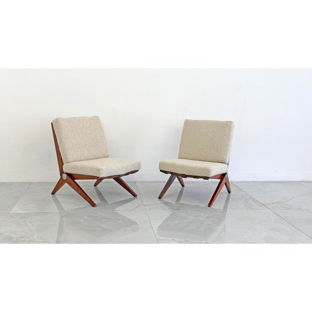 One look at these chairs and you'll be OBSESSED. These original 1960s Model 92 Pierre Jeanneret scissor chairs are a lot...