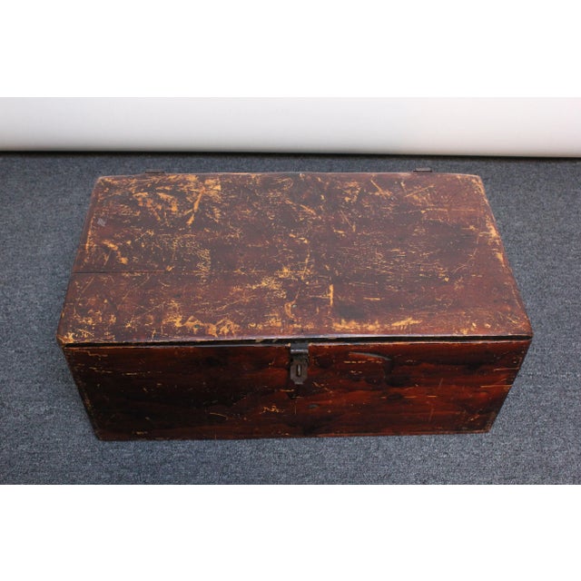 Handmade travel trunk carved from maple wood planks with applied steel hinges and clasp. The hinged top opens to reveal a...