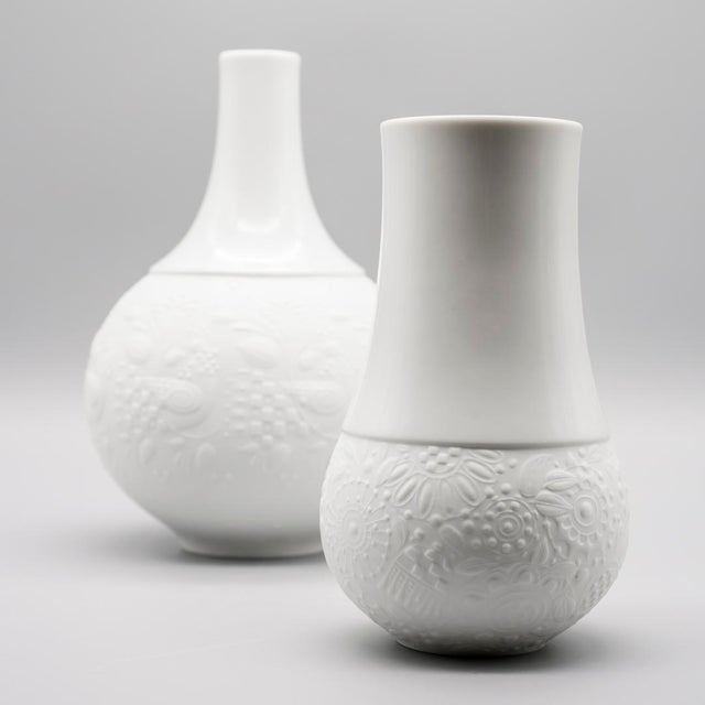 White porcelain vase duo designed by Bjørn Wiinblad for Rosenthal Studio-Line in 1967–68. Both pieces combine a smooth,...
