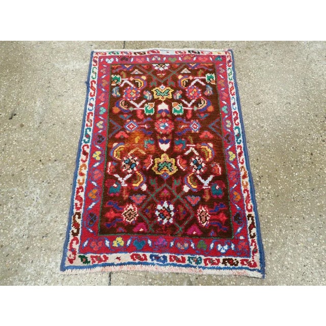 A vintage Persian hamadan rug from the mid-20th century. Hamadan town and the surrounding weaving area of about 120...