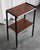 The side table comes from Italy, has a black metal structure, two wooden storage surfaces with white trim. The ends of the...