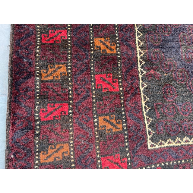 Vintage Baluchi Rug Hand-Knotted Wool Tribal Design, Deep Burgundy & Earth Tones Rug For Sale - Image 11 of 13