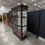Howard Miller Townsend lighted curio cabinet, model 680-235, in the Windsor Cherry finish with a full mirrored back,...