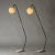 Pair of striking floor lamps by Svend Aage Holm Sørensen, made from black lacquered metal with sculpted v-shaped bases....