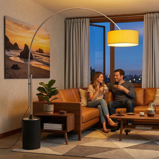 The Tambo Arc Lamp is a Mid-Century Modern floor lamp designed by Peter Morelli in 1984, featuring a satin nickel finish...