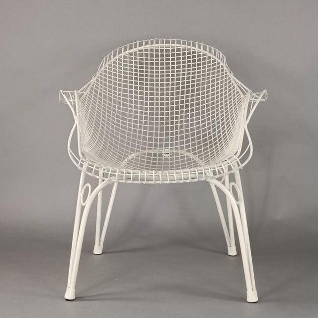 Elegant outdoor table and armchair set, with a 1950s design. White enameled iron frame, original 15mm glass table top....