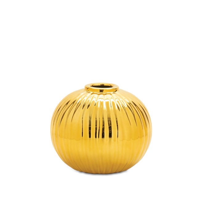 Add a bold touch of elegance to your space with this 4" Gold Ceramic Decorative Vase. With its rounded silhouette and...