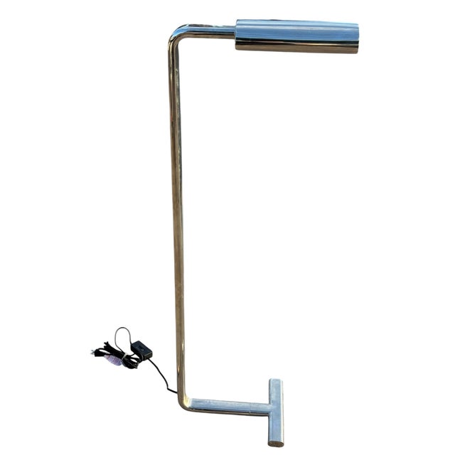 This chrome reading floor lamp with T-shaped base is an exquisite blend of timeless design and functional elegance. With...