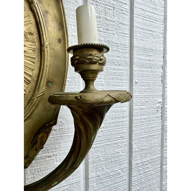 Metal Antique Ornate Bronze French Empire Style Garland Sconce With Versace Style Sunface Detail For Sale - Image 7 of 7