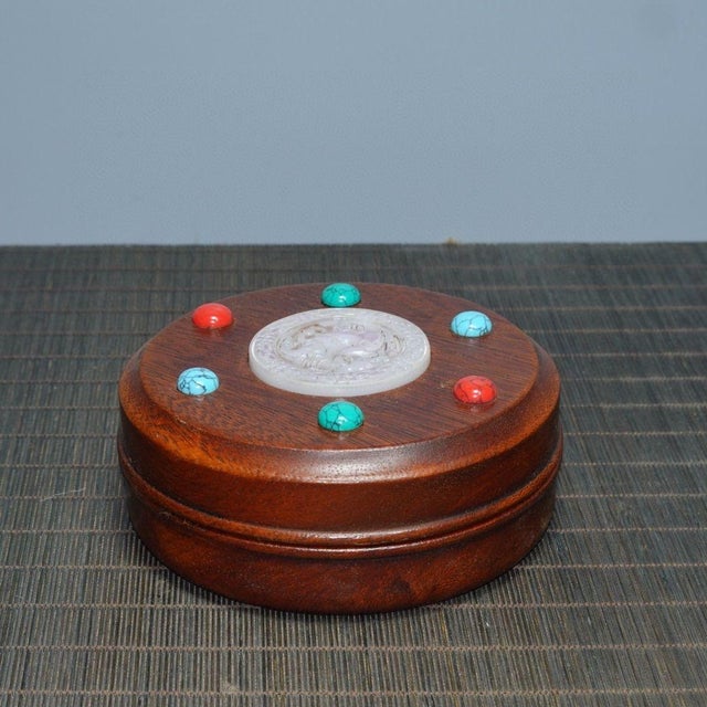 This is an elegant vintage Chinese Huali (Rosewood) round box, featuring a sophisticated jeweled lid. At the center of the...