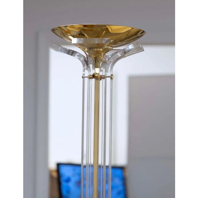 An Italian Gilded Brass and Lucite Torchiere Floor Lamp Circa 1970s. This gorgeous floor lamp embodies the essence of...