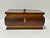 Solid wood Victorian tea caddy from the 1800s. It is bombe shaped with contrasting lighter wood banding and a small...