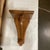 A hand carved wood wall shelf from mid-century England. These sturdy and handsome medium wood grain color shelves have a...