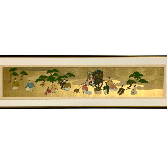 This vintage large framed Japanese panoramic painting depicts a scene from the Heian Court on gold leaf, showcasing...