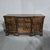 A very good walnut and mahogany crossbanded breakfront dresser base, standing on bracket feet, three central drawers with...