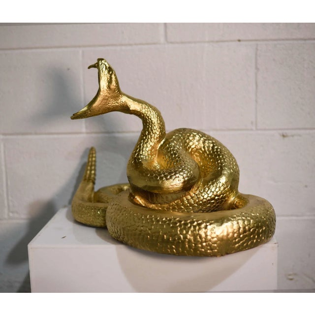 This Vintage Gilded Cast Metal Rattlesnake is a unique piece that will add character to any space. It is crafted from...