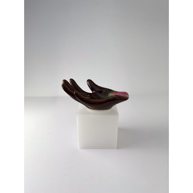 An ornamental hand-shaped dish by Vallauris, handcrafted in 1960s France. Formed from ceramic in the shape of a human...