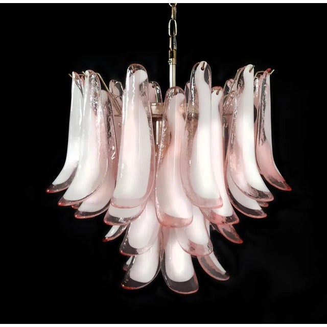 Fantastic chandelier with pink and white “lattimo” glasses, nickel-plated metal frame. It has 36 big monumental petals...