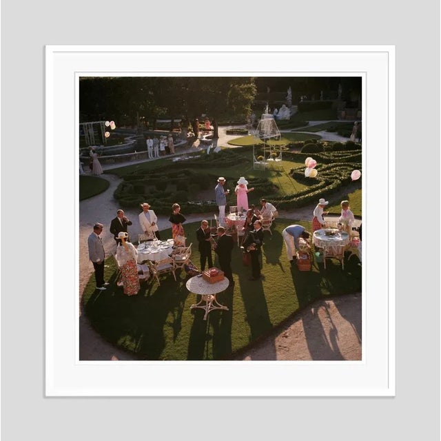Garden Party' by Slim Aarons Open Edition 1970: An elegant garden party in Miami, Florida. (Photo by Slim Aarons). An...
