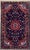 Hand-knotted rug from the Hamadan region of western Iran, featuring a large central medallion set within a dark navy...