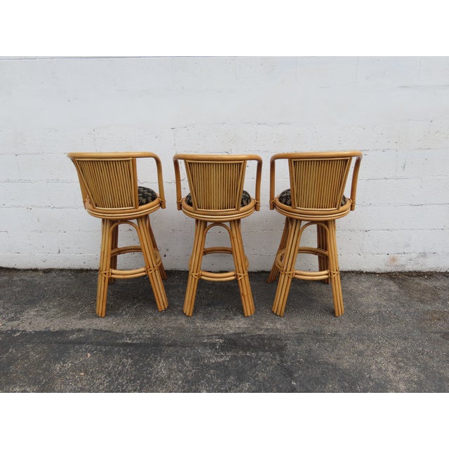 This beautiful Bar Stools is made of bamboo, rattan, and upholstery. This Set of Swivel Bar Stools are a brilliant example...