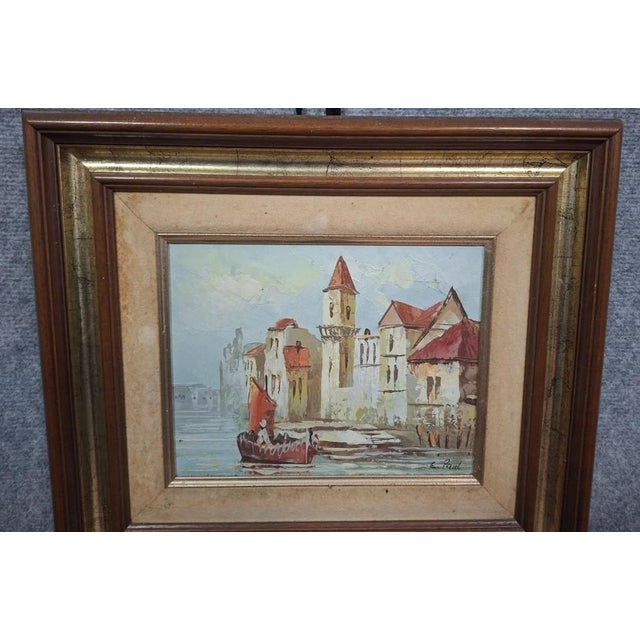 Charming oil on canvas depicting a lively harbor scene. in the style of medieval flemish or dutch cities, the composition...