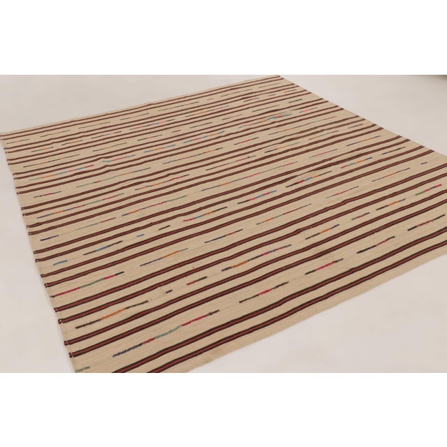 Handwoven in wool, this 8x9 vintage Persian kilim is a sophisticated addition to Rug & Kilim’s Kilim & Flatweave...