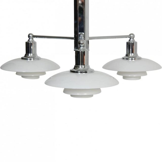 Poul henningsen ph2/1 stemfitting chandelier with white opal glass shades and a chrome frame. The lamp is from around 2010...