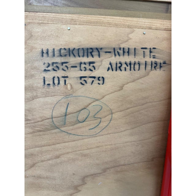Hickory-White armoire wardrobe, American, mid-20th century (1960s-1970s), in a blonde honey stain over a darker base...