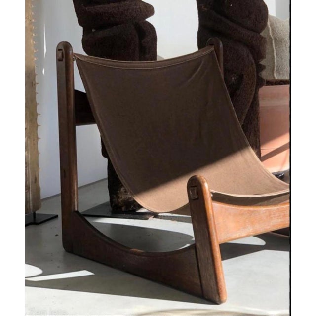 Pair of Brutalist Carl Straub sling chairs. 1970's. Canvas & Oak. Dims: 30"w x 31"d x 35"h
