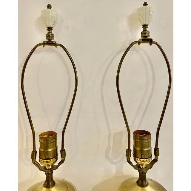 lovely pair of ceramic table lamps with relief flowers. Art Nouveau style in an off white color and brass accents. Bases...