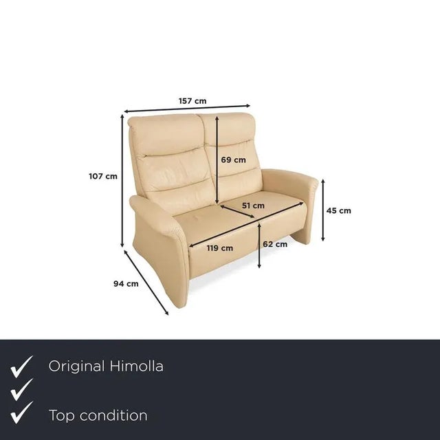 This Himolla sofa is upholstered in beige leather and features floor-to-ceiling side panels. The two-seater is...