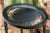 Vintage high quality ebonized oval-shaped side or accent table with a removable tray-top with delicate polychrome hand-...