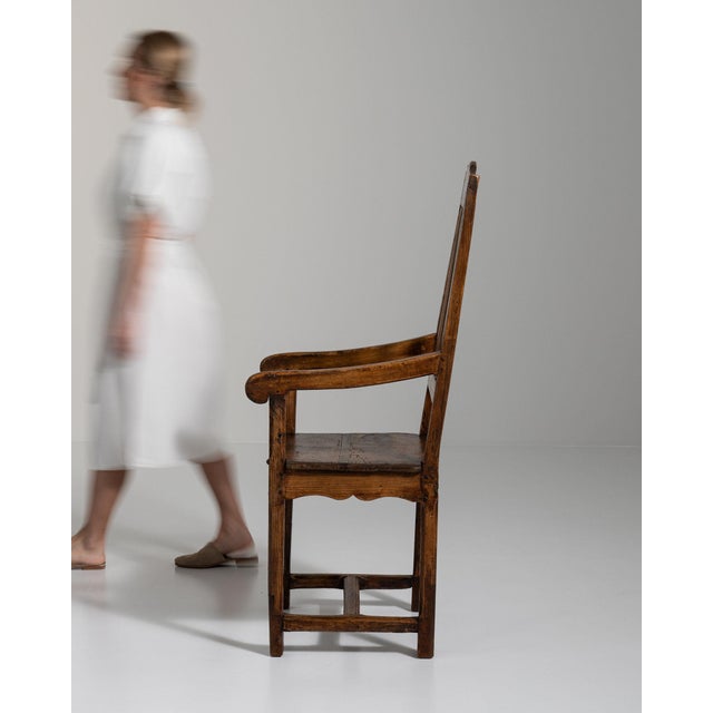 This dining chair carries genuine presence, its dark aged wood, ladder slat immediately setting the tone for the piece....