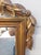 Antique Italian neoclassical giltwood mirror, c.1900 Having a central urn to the pediment with flowers and flowing...