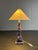 Lovely table lamp attributed to France in faux marble ( resin composite ) fitted for a general E14 lightbulb, 1980s. The...