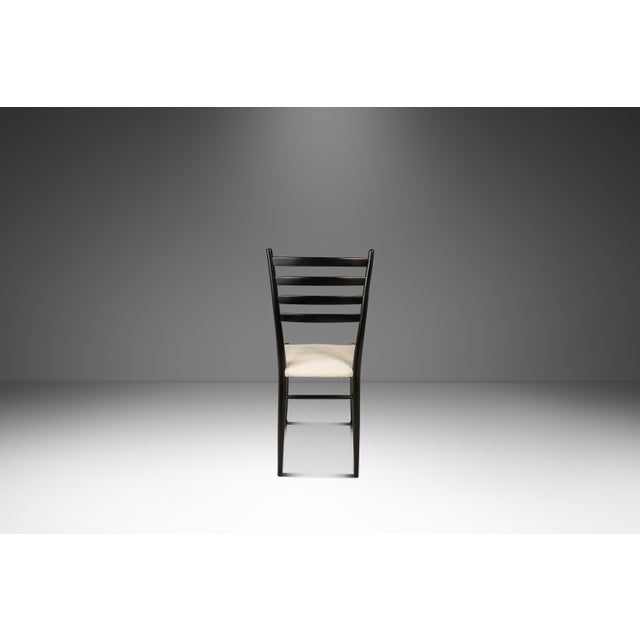 Introducing a limited, expansive set of twelve Italian-made dining chairs designed and crafted in the manner of Gio...