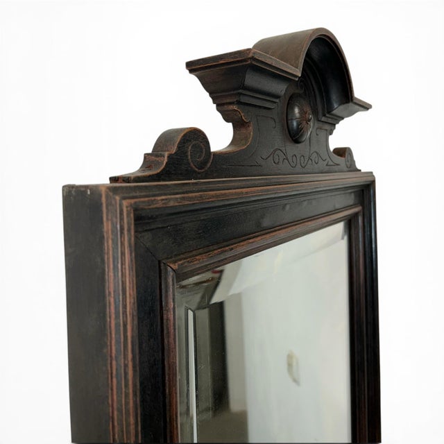 Antique mirror with console in black. The set consists of two parts: the mirror at the top and the console at the bottom....